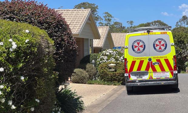An ambulance outside a house.